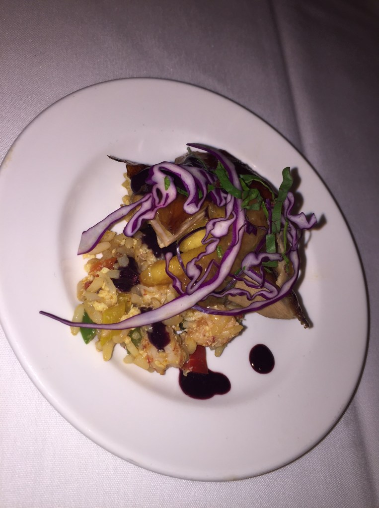 Honey roasted crispy duck, crawfish fried rice and blueberry duck sauce