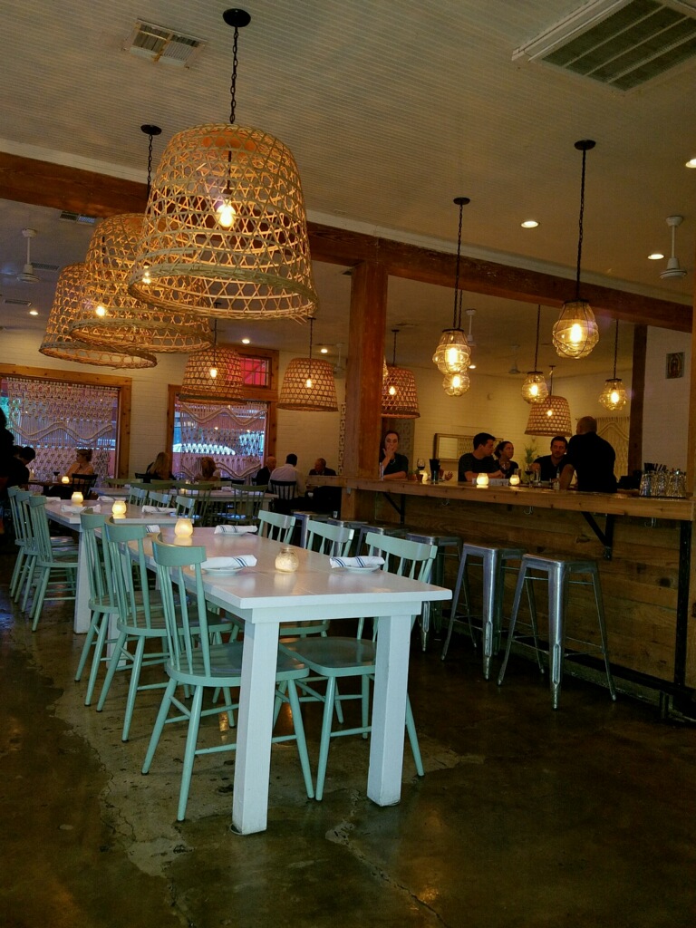 Super cute restaurant. The light-colored furniture made it feel very inviting ... 2 Girls Who Travel recommends this place if you're traveling to Austin!