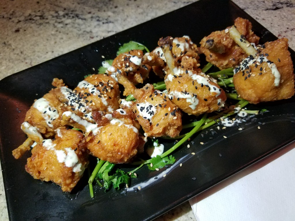 Oak Wing Pops with Cajun Zing and Jalapeno Cilantro Ranch: not only were these wings cute, they tasted delicious. The drizzle of sauce really set them off.