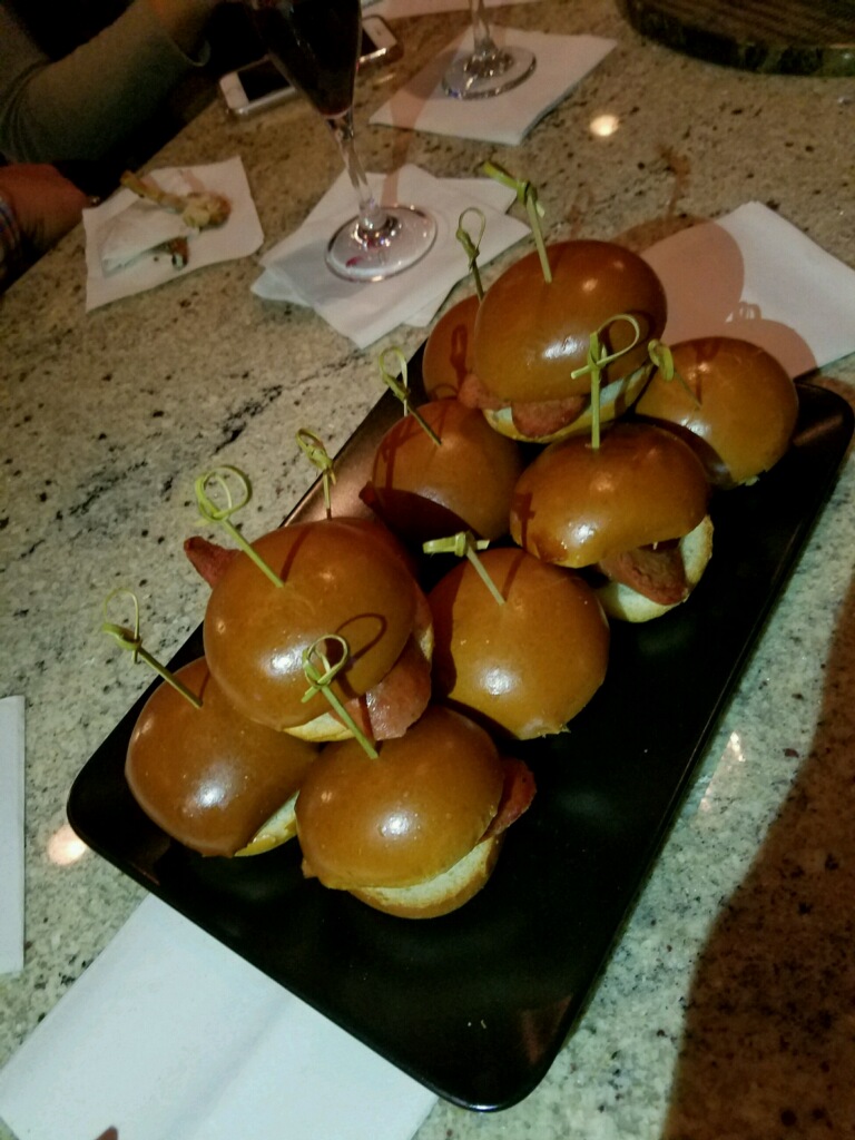 Andouille Sausage Sliders with Honey BBQ Sauce and a Dill Pickle on a Brioche Bun: it was hard to eat just one of these bite-size appetizers!