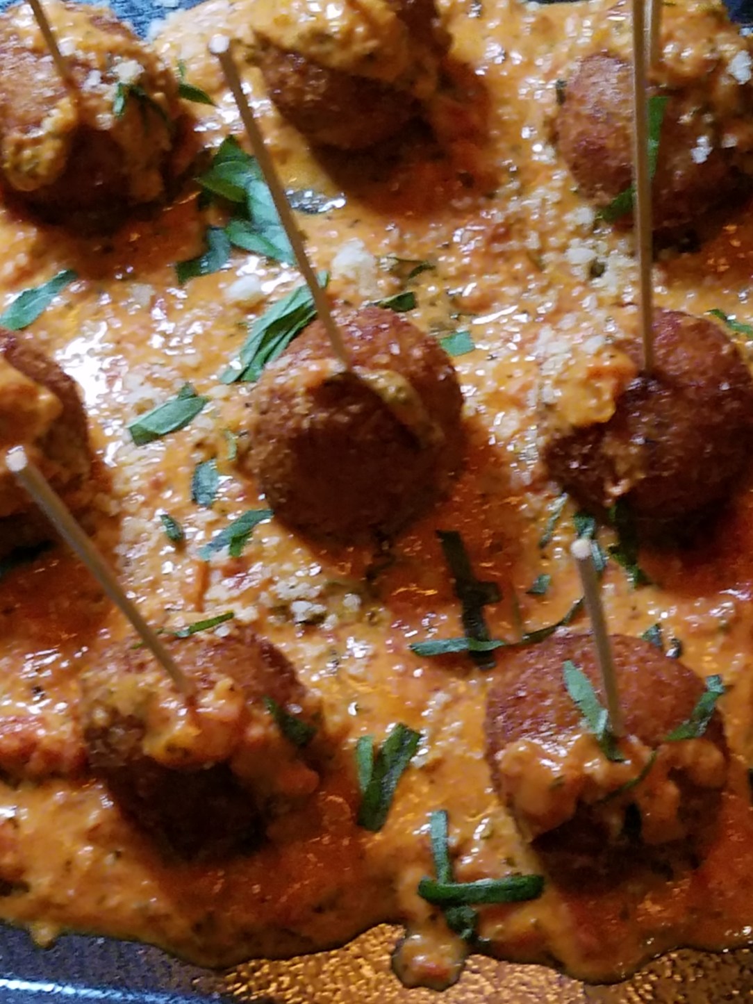 Arancini with marinara sauce (also known as risotto balls)