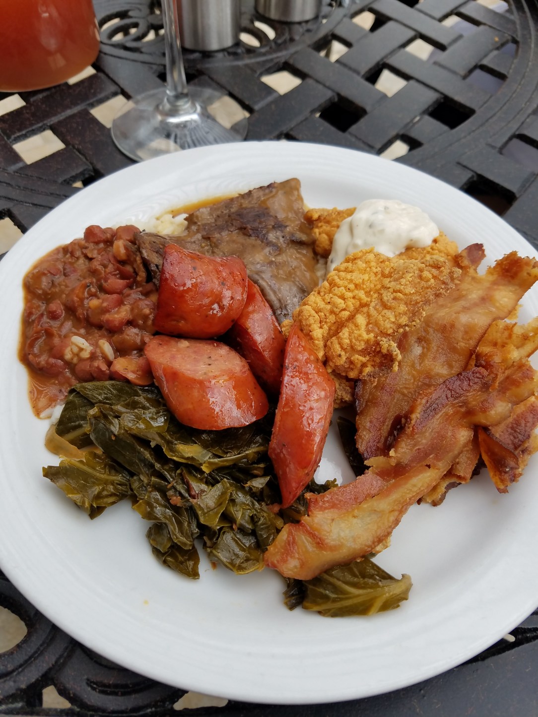Just a sampling - greens, sausage, red beans & rice, smothered steak, catfish and slice of bacon